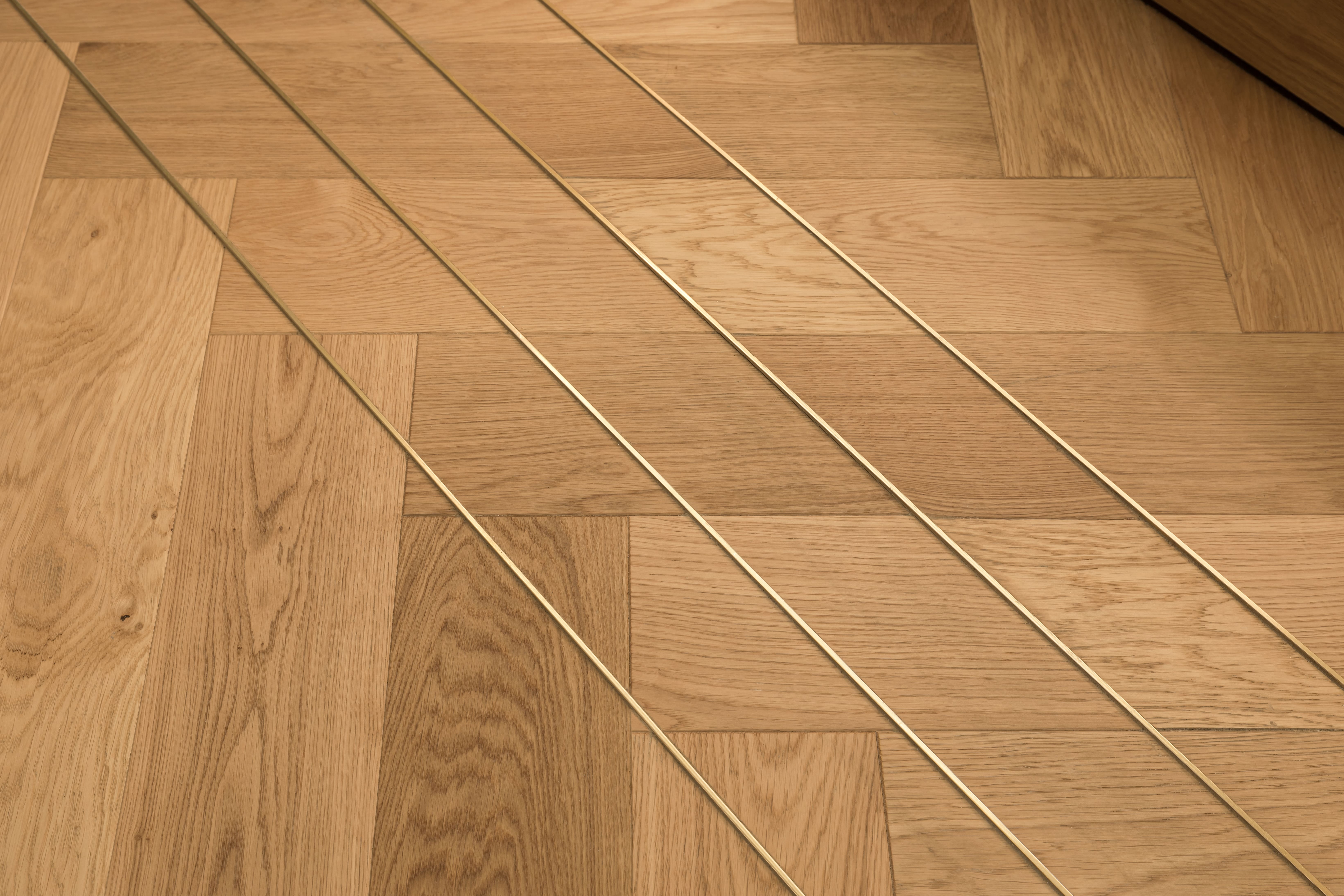 Detail of engineered timber floor with underfloor heating